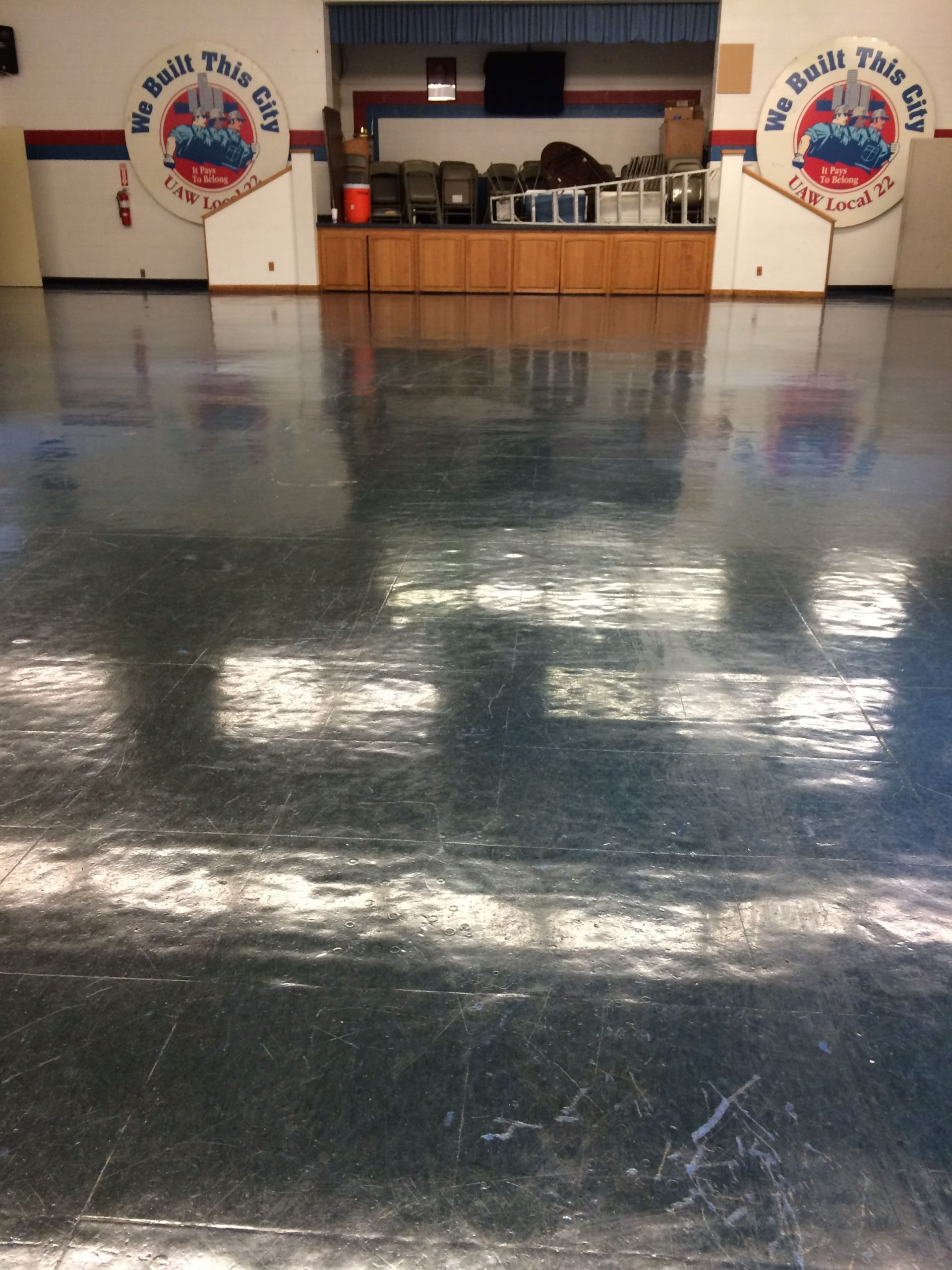 Dirty Auditorium Floor at Union Building being prepared for cleaning